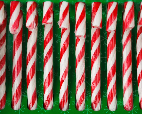 Candy canes in green pack — Stock Photo, Image