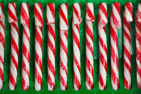 Candy canes in green pack — Stock Photo, Image