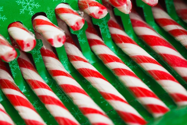 Candy canes in green pack — Stock Photo, Image