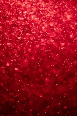 Kanlı kırmızı arka plan ile bokeh parçacıklar