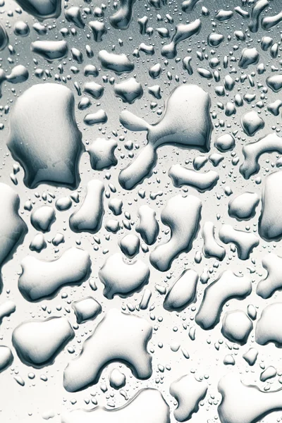 Gotas de água no fundo de aço inoxidável — Fotografia de Stock