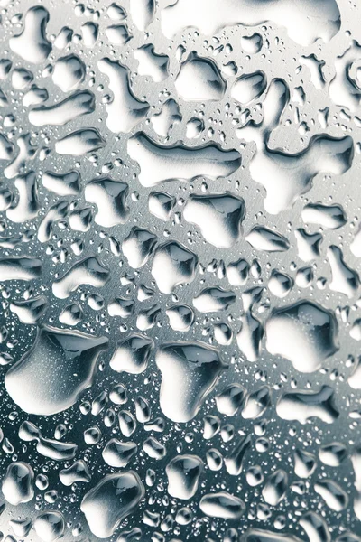 Water drops on stainless steel background — Stock Photo, Image