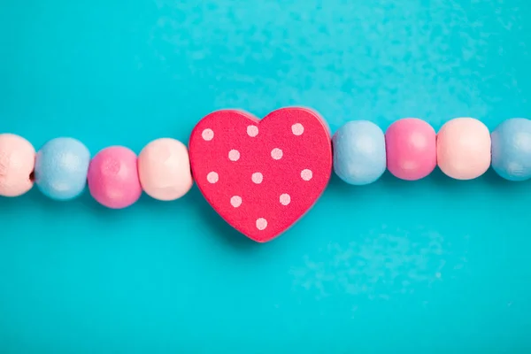 Toy heart shape on blue background — Stock Photo, Image