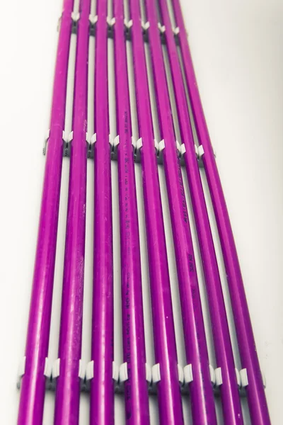 Purple plastic pipes of underfloor heating system — Stock Photo, Image