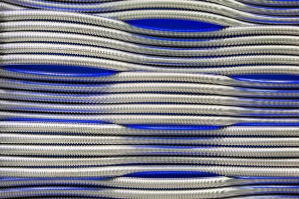 Corrugação tubos de metal abstrato fundo azul — Fotografia de Stock