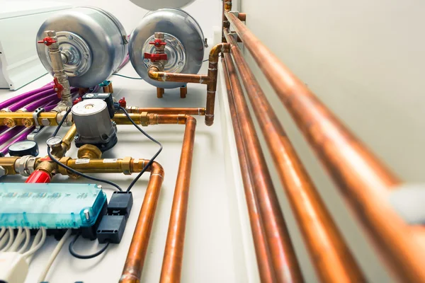 Copper pipes engineering in boiler-room Stock Image