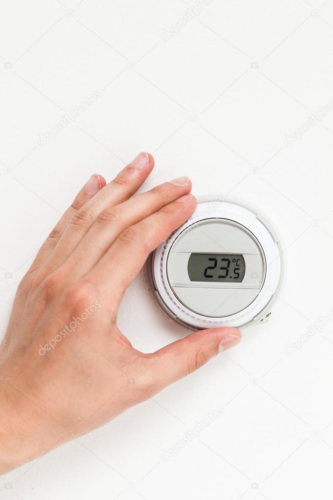 digital climate thermostat controlling by hand