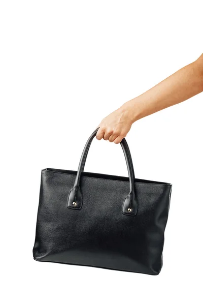 Hand holding women's leather handbag — Stock Photo, Image