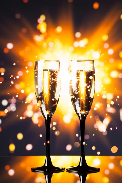 Champagne glass against sparkler background — Stock Photo, Image