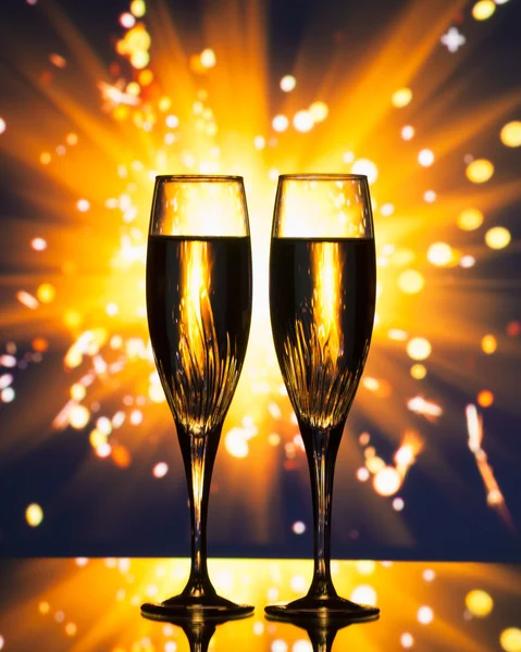 Champagne glass silhouette against sparkler background — Stock Photo, Image