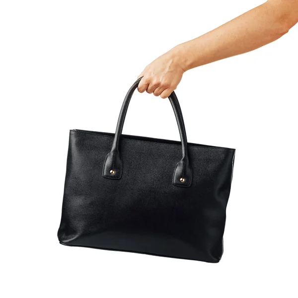 Ruka držící dámská kožená kabelka — Stock fotografie