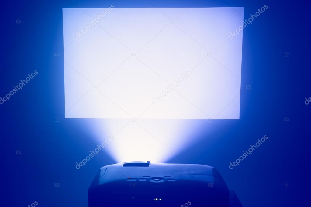 projector in action with illuminated screen