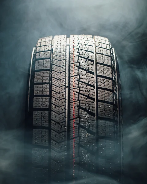 winter tire in smoke