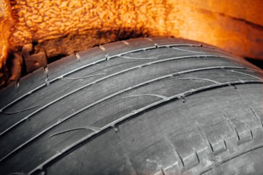 used car tire with worn-out depth of thread clipart