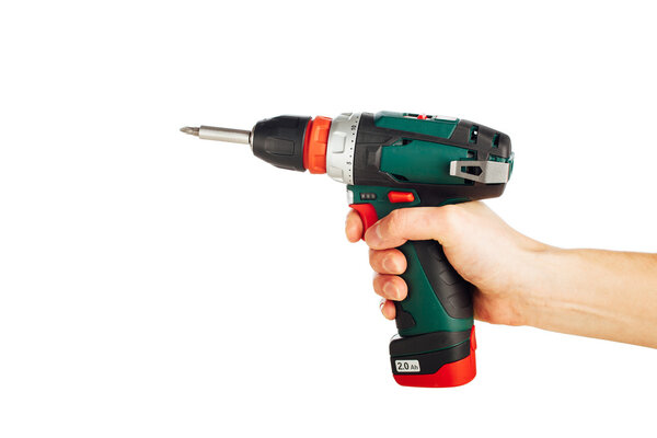 cordless screwdriver in hand, isolated on white