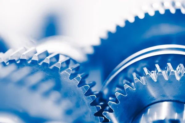 Промышленный фон с синими зубчатыми колесами — стоковое фото