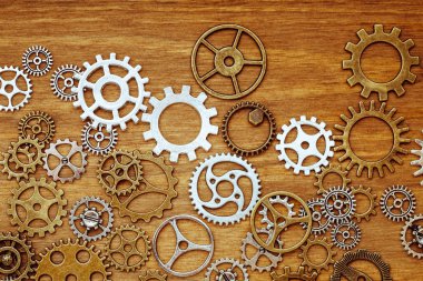 ahşap arka plan üzerinde Vintage dişli tekerler