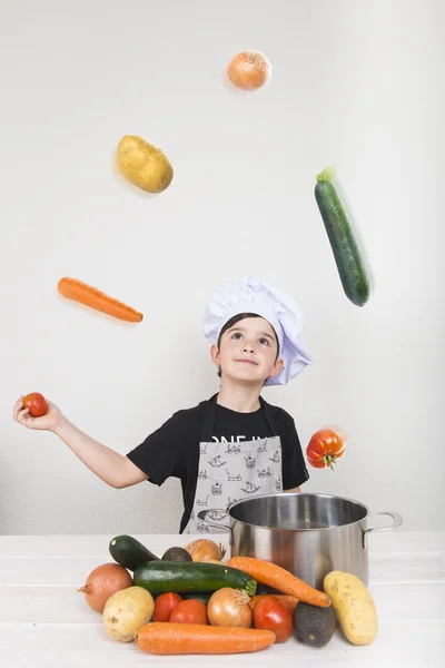 Child cooking with vegetables — Stock Photo, Image