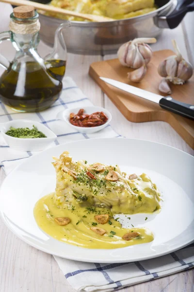 Bacalhau salgado em molho pilpil — Fotografia de Stock