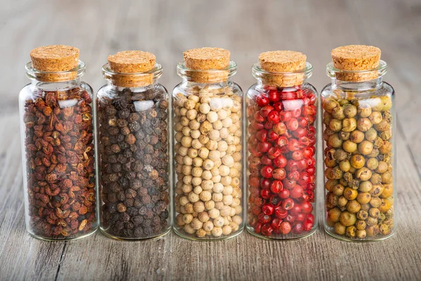 Black White Red Green Sichuan Pepper Corns Glass Jars — Stock Photo, Image