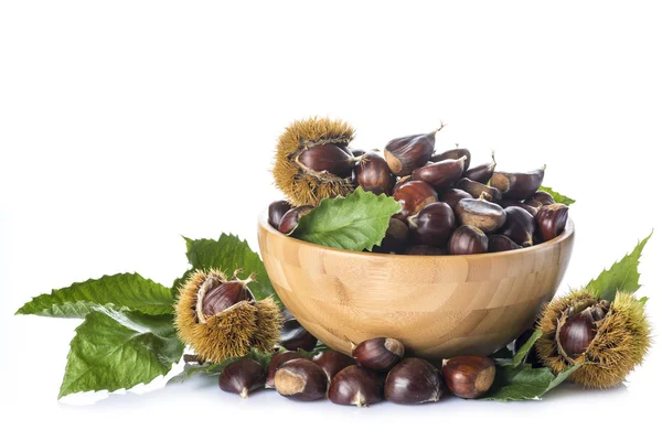 Chestnuts in a wooden bowl isolated on a white background — Stock Photo, Image