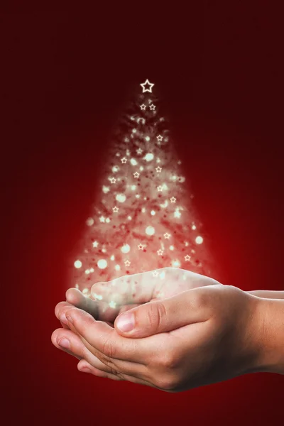 Christmas card with a child hands in red — Stock Photo, Image