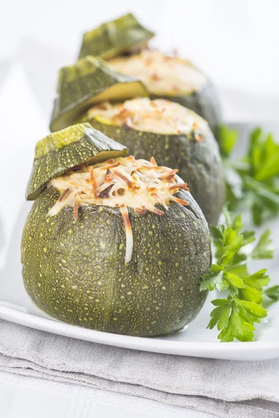 Stuffed round courgettes with grated cheese — Stock Photo, Image