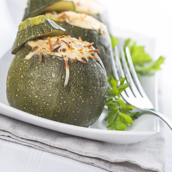 Stuffed round courgettes with grated cheese — Stock Photo, Image