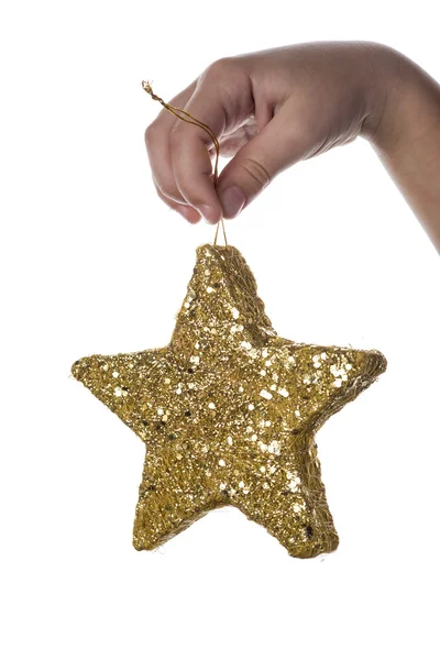 Christmas background with a hand holding a star — Stock Photo, Image