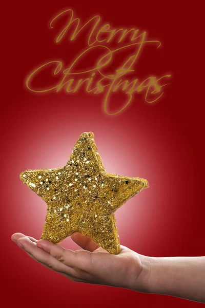 Kerstmis achtergrond met een hand met een ster — Stockfoto
