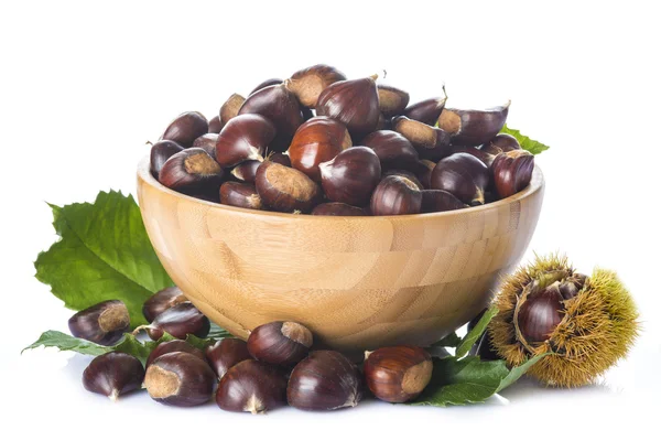 Chestnuts in a wooden bowl isolated on a white background — Stock Photo, Image