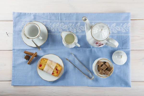 Candied fruits cake with tea and coffee for breakfast