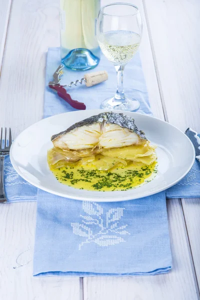 Oven baked cod fish with potatoes — Stock Photo, Image