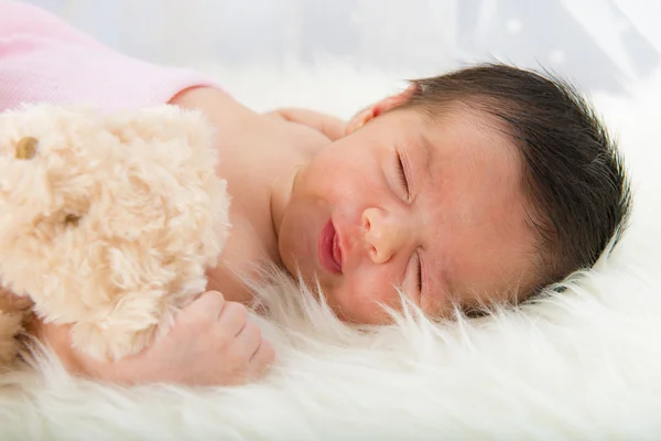 Happy newborn girl whit her teddy — Stock Photo, Image