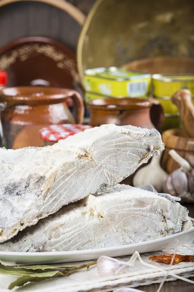 Salted cod cut on the table of the kitchen — Stock Photo, Image