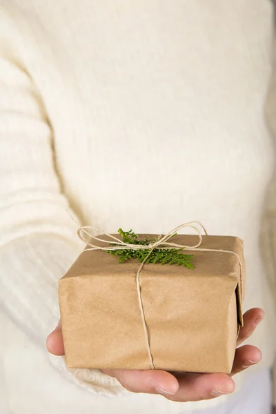 Woman hands holding a gift box — Stock Photo, Image