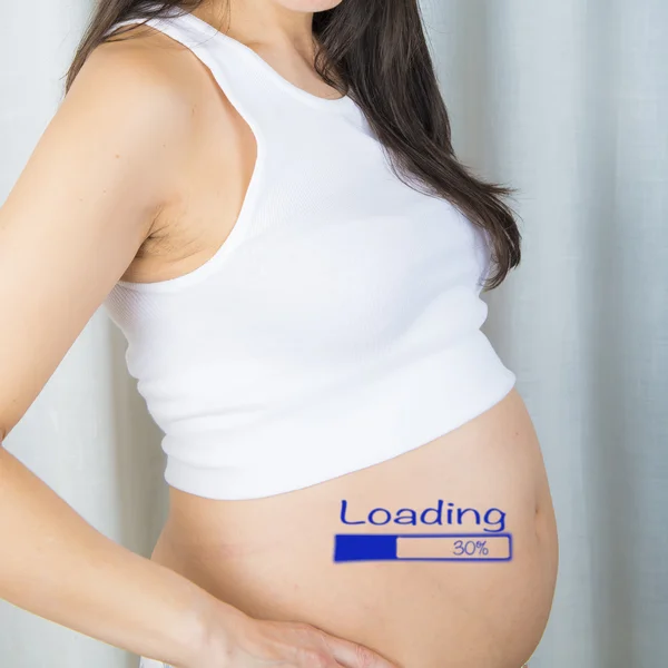 Pregnant with a progressbar on her belly — Stock Photo, Image