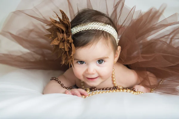 Smiling baby ballerina in brown tutu — Stock Photo, Image