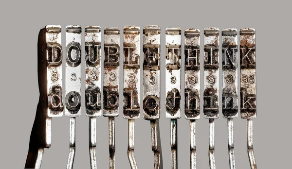 Vintage Old Typewriter Hammers Word Doblethink — Stock Photo, Image