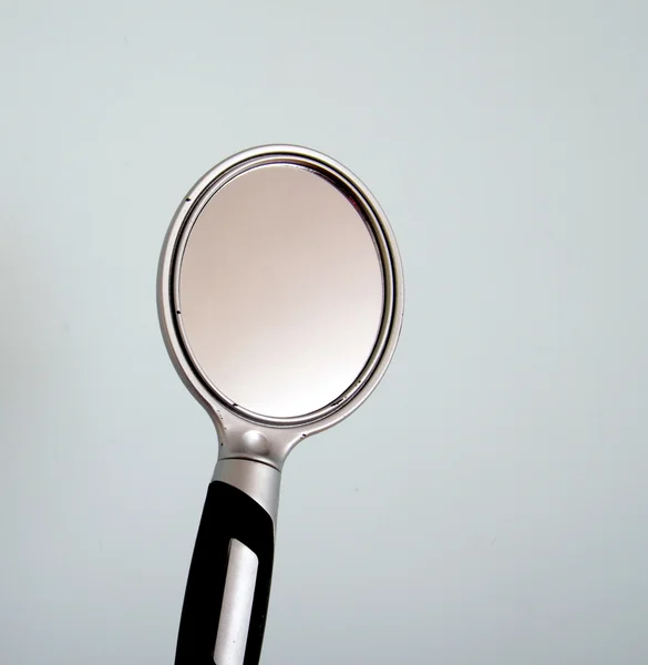 Cheap plastic hand mirror — Stock Photo, Image