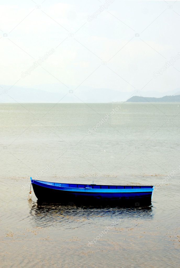 Blue boat on a lake prespa in macedonia