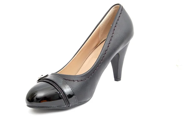 Sexiga svarta kvinnliga skor på en vit bakgrund. — Stockfoto