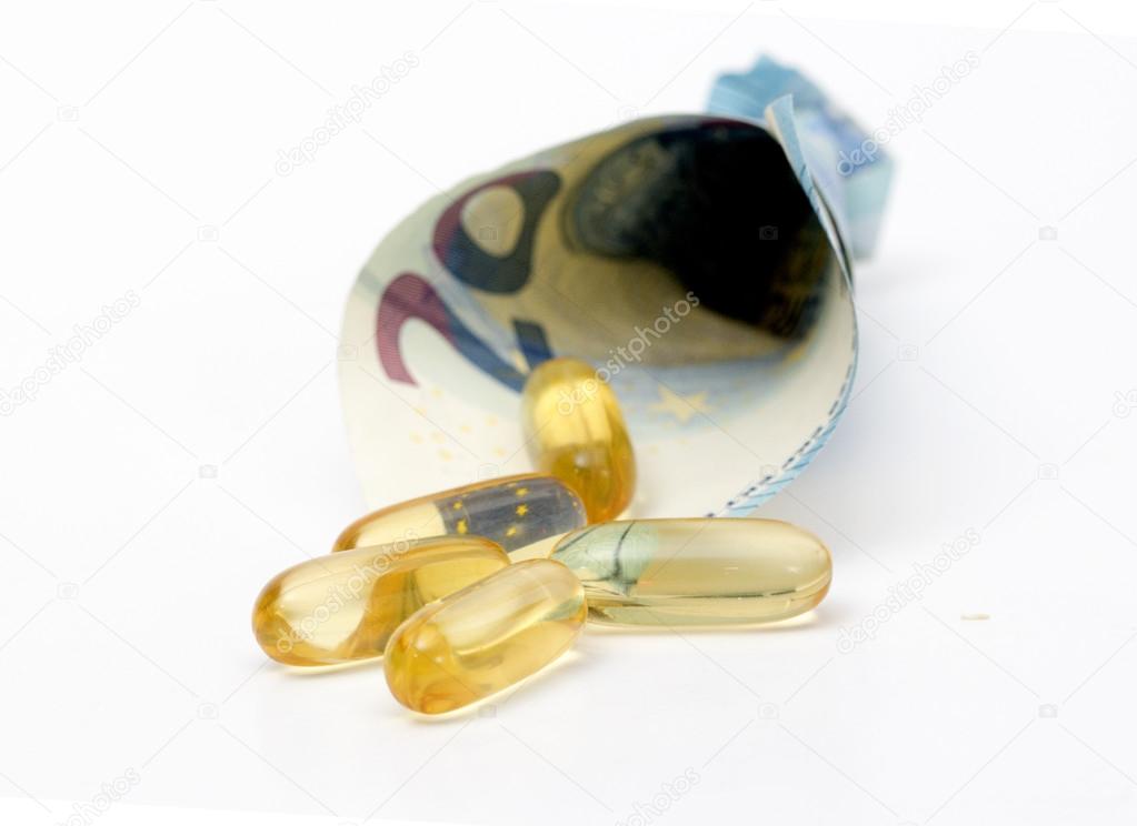 Cod liver oil omega 3 gel capsules spill out from euro banknote