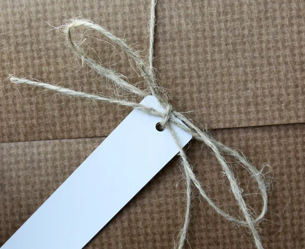 Parcel tied with white string with address label attached