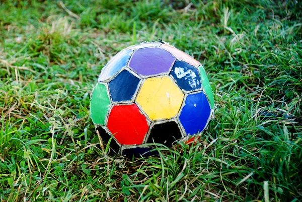 Football ball, colorful, old, ragged — стоковое фото