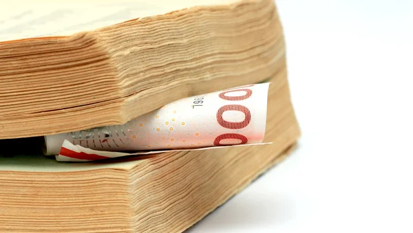 1000 danish kroner between pages of an old book — Stock Photo, Image