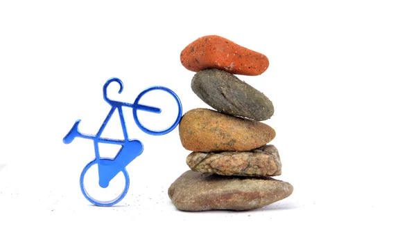 Toy bike and stones in studio — Stock Photo, Image