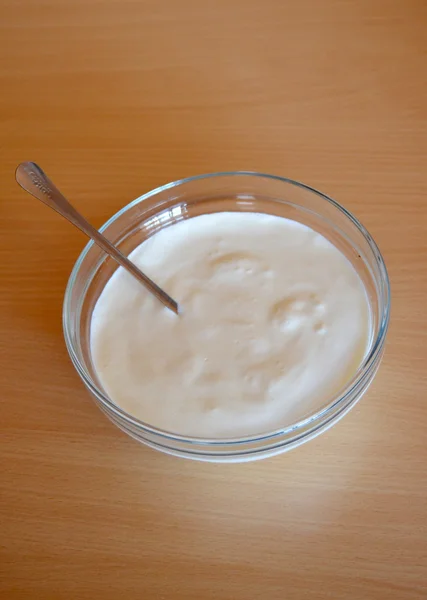 Fresh butter milk isolated on wood background — Stock Photo, Image
