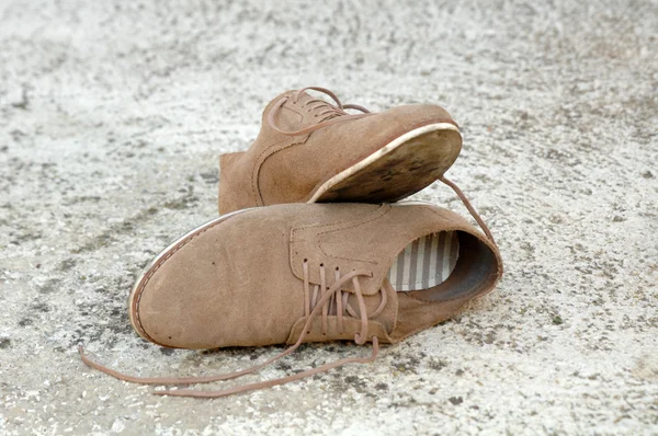 Male shoes on cement background — Stock Photo, Image