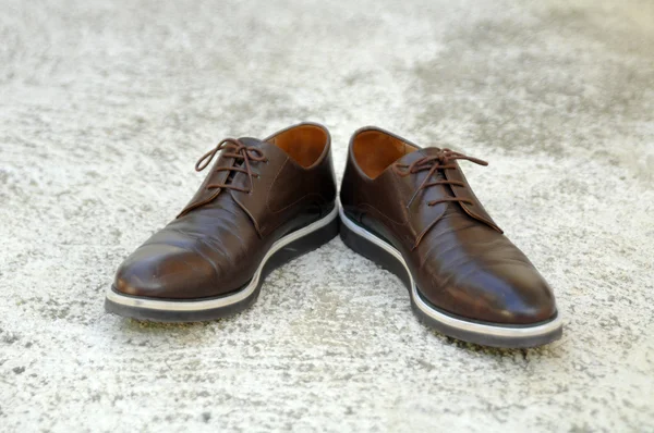 Male shoes on cement background — Stock Photo, Image